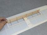 The "Spoiler" is a simple plate stiffened by small balsa slats. It will simply be "pushed" by the arm of a micro servo and the retracted position will be locked by a magnet.